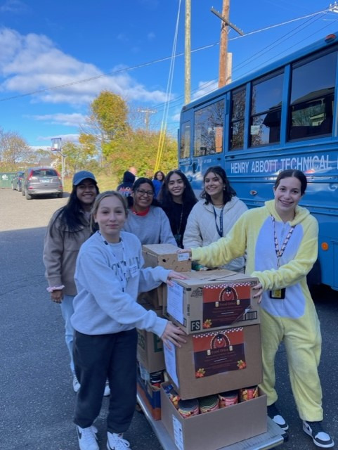 Students transporting donated food