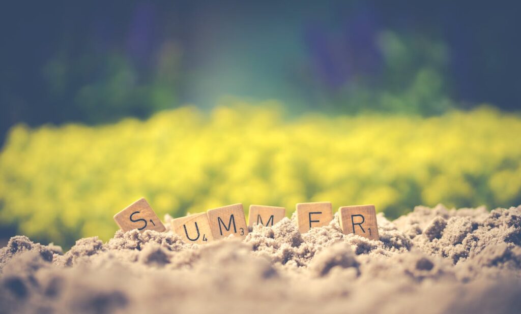 Scrabble tiles in sand