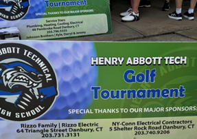 Sign that says Henry Abbott Tech Golf Tournament