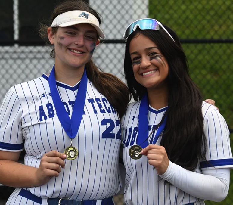 Abbott student softball players wearing medals.