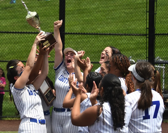Abbott Softball players holding trophy.